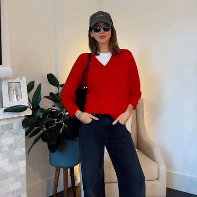 @ambervscott chic with a pop of red in our classic wool v neck sweater