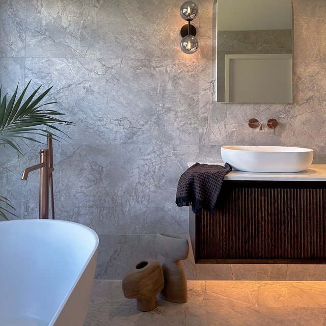 Still in awe over this space 😍 We love when client goes bold with a pop of colour. This copper nature tapware is a stunning use of colour paired with a timeless large format tile to tie it all together 

#bathroom #bathroomrenovation #renovation #design #interiordesign #bathroomdesigns #bathroomreno #interiors #vanity #tiles