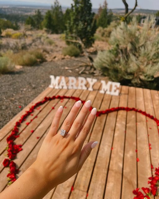 How could you say no? Beautiful proposal, A+ engagement ring. Congrats to @kaitlyn.springer on your engagement!

The Details: 18K White Gold Luxe Lissome Diamond Ring set with a Radiant Cut Diamond 💎 

Save to manifest your summer proposal 💍☀️