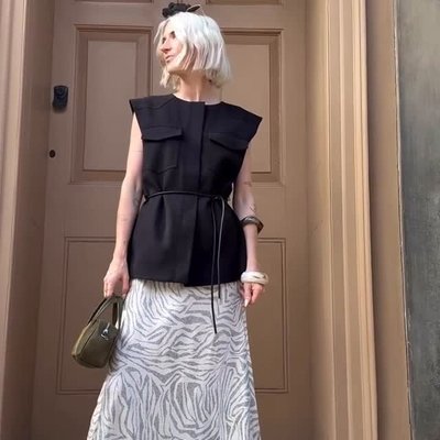 @emmasnowdonstyle looks effortlessly chic in our new Clover Tie Waistcoat and Josie Eco Ennis Skirt. 🤍