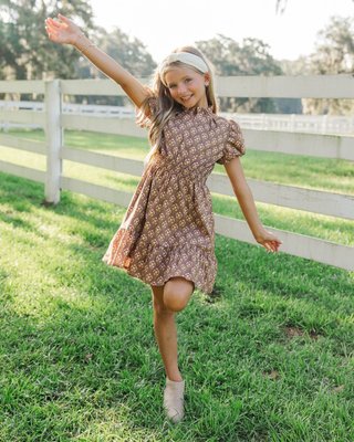 Earthy tones, timeless charm 🤎 The Let’s Get Going Brown Medallion Dress is part of our Fall Family Photo Edit—perfect for coordinating looks and capturing family moments this season. 📸

$40 >> Girls: Let's Get Going Brown Medallion Dress

#girlsoutfitideas #girlsstyleinspo #girlstyleinspo #momsofgirls #southernmomstyle #ShoptheMintGirls #girlsdresses #momanddaughter #familyphotos