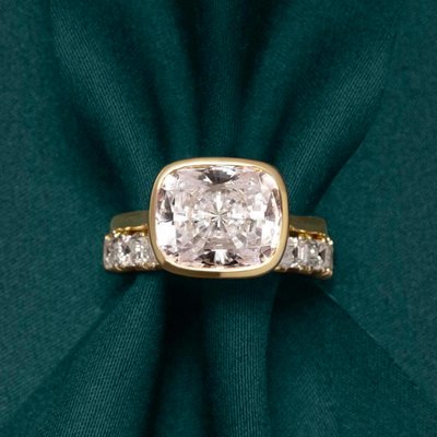 Unique engagement rings are having a moment in 2026. Tag someone who needs to see this ring. The details: 18K Yellow Gold Arden Diamond Ring with Lab Emerald Accents set with a Marquise Diamond