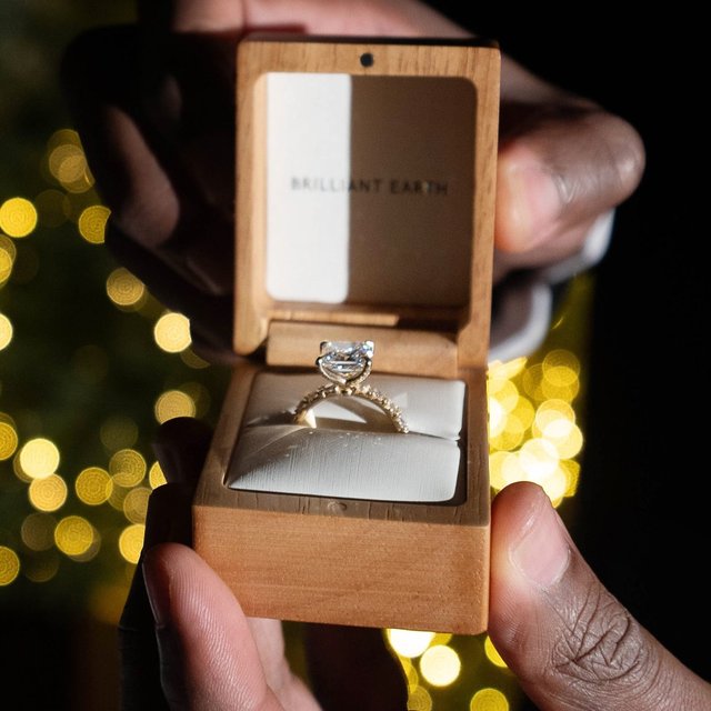 When the proposal feels like a movie. Congrats to @a1dowell and @taymullins\_ on your engagement. 📷: @kissmeinparis The details: 18K Yellow Gold Ellora Three-Quarter Coverage Diamond Ring set with a Princess Cut Diamond