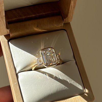 Say less. 💍 A one of a kind Pacific Green colored lab diamond set in a yellow gold bezel. Would you say yes?